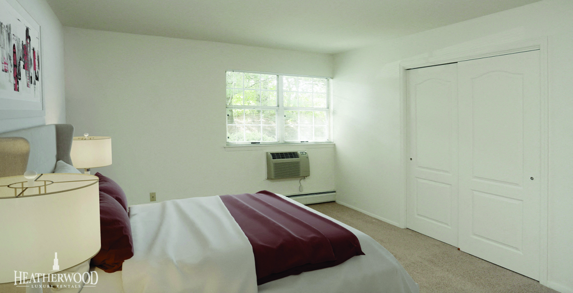 Bedroom With Expansive Windows at Villas at Pine Hills, New York